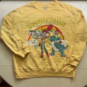 Disney Women’s Yellow Toy Story Sunnyside Daycare Sweatshirt